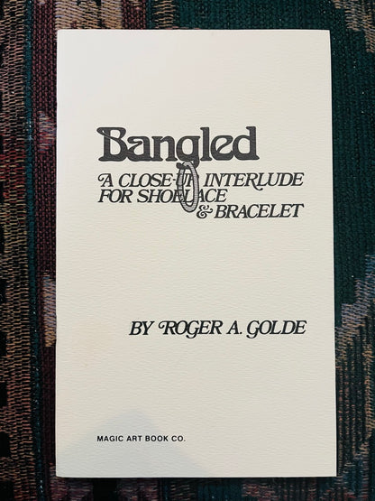 Bangled: A Close-Up Interlude for Shoelace & Bracelet - Roger A. Golde