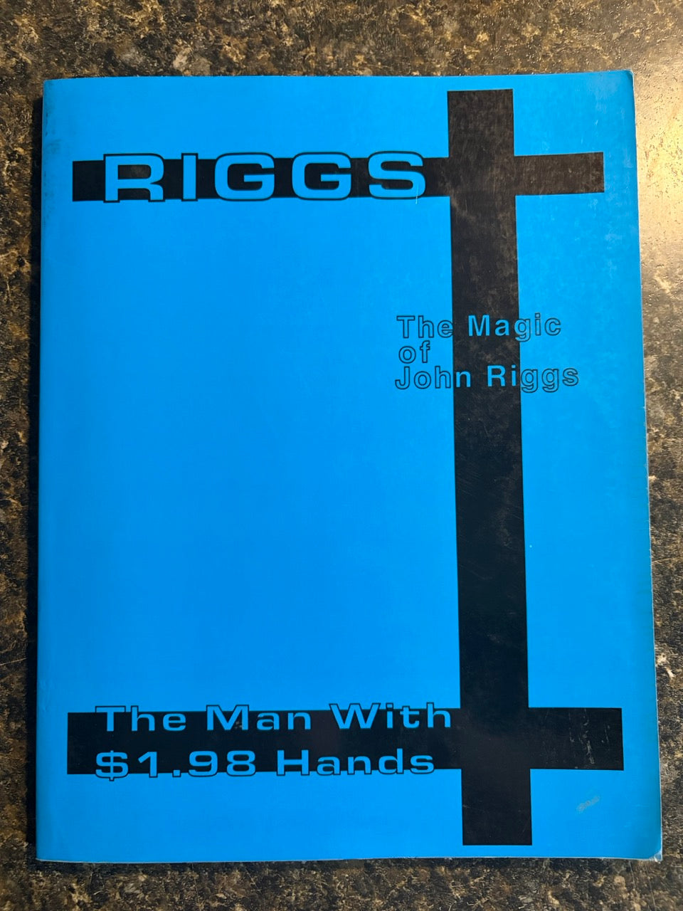The Man With $1.98 Hands - John Riggs
