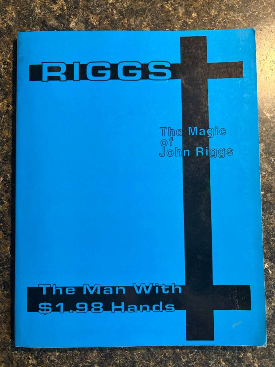 The Man With $1.98 Hands - John Riggs